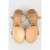 Beige sandals with golden straps
