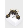Black sandals with golden straps
