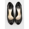 Black leather pumps with decorative stitching