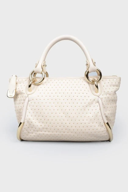 Dairy leather bag with golden fittings