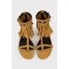 Suede sandals in a finger with a tag
