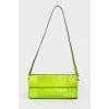 Green neon clutch with tag