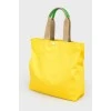 Yellow shopper with a print with a tag