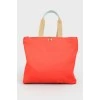Red shopper with a print with a tag