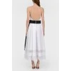 White sundress with a black bow with a tag