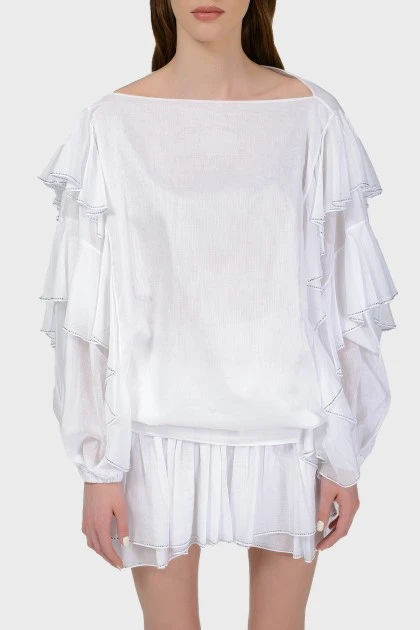 White blouse with voluminous sleeves with a tag