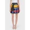 Skirt in an abstract cage with a tag