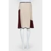 Light skirt with burgundy inserts