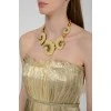 Necklace in the form of beige shells with tag
