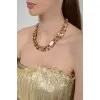 Golden necklace with square stones with tag