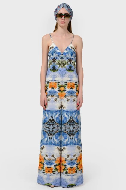 Assumes on straps with an abstract print with a tag
