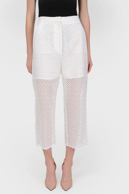 Openwork shortened trousers with a short lining with a tag