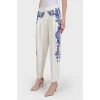 Pants with blue embroidery with tag