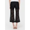 Shortened lace pants with tags