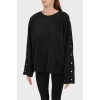 Black sweatshirt with buttons on the sleeves