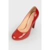 Red patent leather shoes with stiletto heels