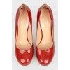 Red patent leather shoes with stiletto heels