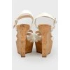 White sandals on high cork wedding