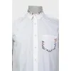 Shirt with embroidery on the pocket and collar