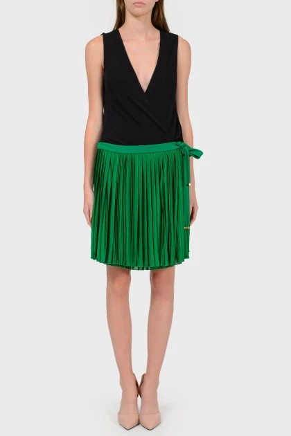 Dress with a green pleated skirt