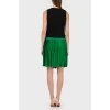 Dress with a green pleated skirt