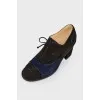Black shoes with a blue suede insert