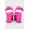 Pink sugous sandals on a wedge