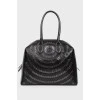 Bag with eyelets and perforations