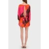 Silk bright dress with a cut on the back