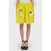 Yellow skirt with floral appliqué