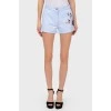 Light blue shorts with beaded appliqué