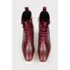 Burgundy boots with white wooden soles