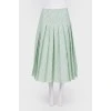 Green skirt in a fold