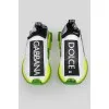 White sneakers with transparent green sole and tag