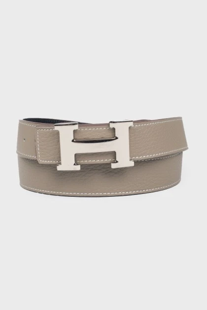 Bilateral belt with a proprietary buckle