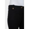 Vintage trousers with creases and golden buttons