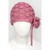 Knitted children's hat with a flower