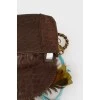 Bag with feathers on a metal chain