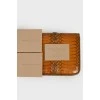 Wallet with an embossed snake pattern