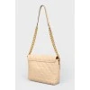 Starned bag made of beige leather