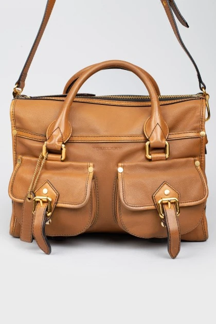 Bag with front buckle pockets
