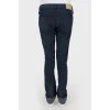 Mid-rise jeans with golden button