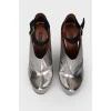 Silver shoes with raised toe