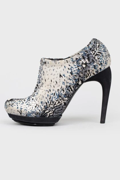 Textile ankle boots with a figured stud