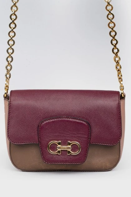 Handbag with a long chain handle