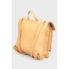 Rectangular leather backpack with tag