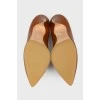 Caramel colored leather pumps