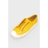 Yellow leather sneakers on lacing