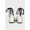 White leather boots with black inserts