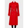 Red coat fitted with a belt